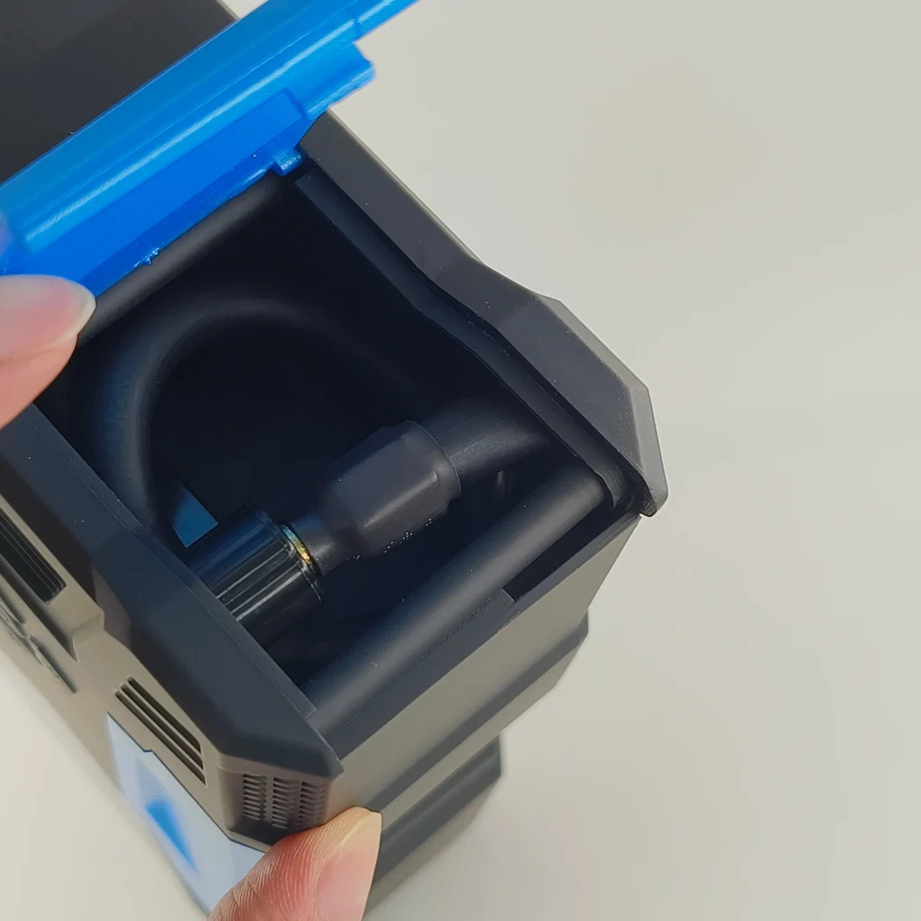 Open container with black hose inside.